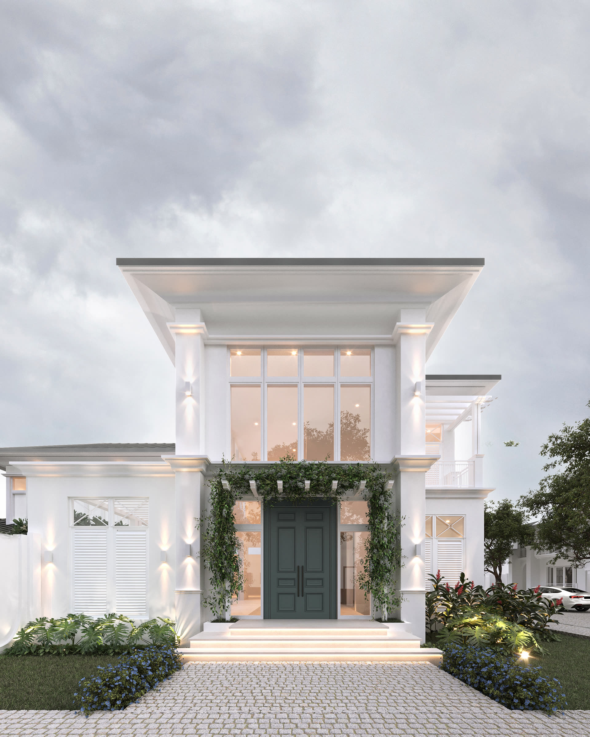 Ingreso principal con puerta oscura y pérgola de vidrio