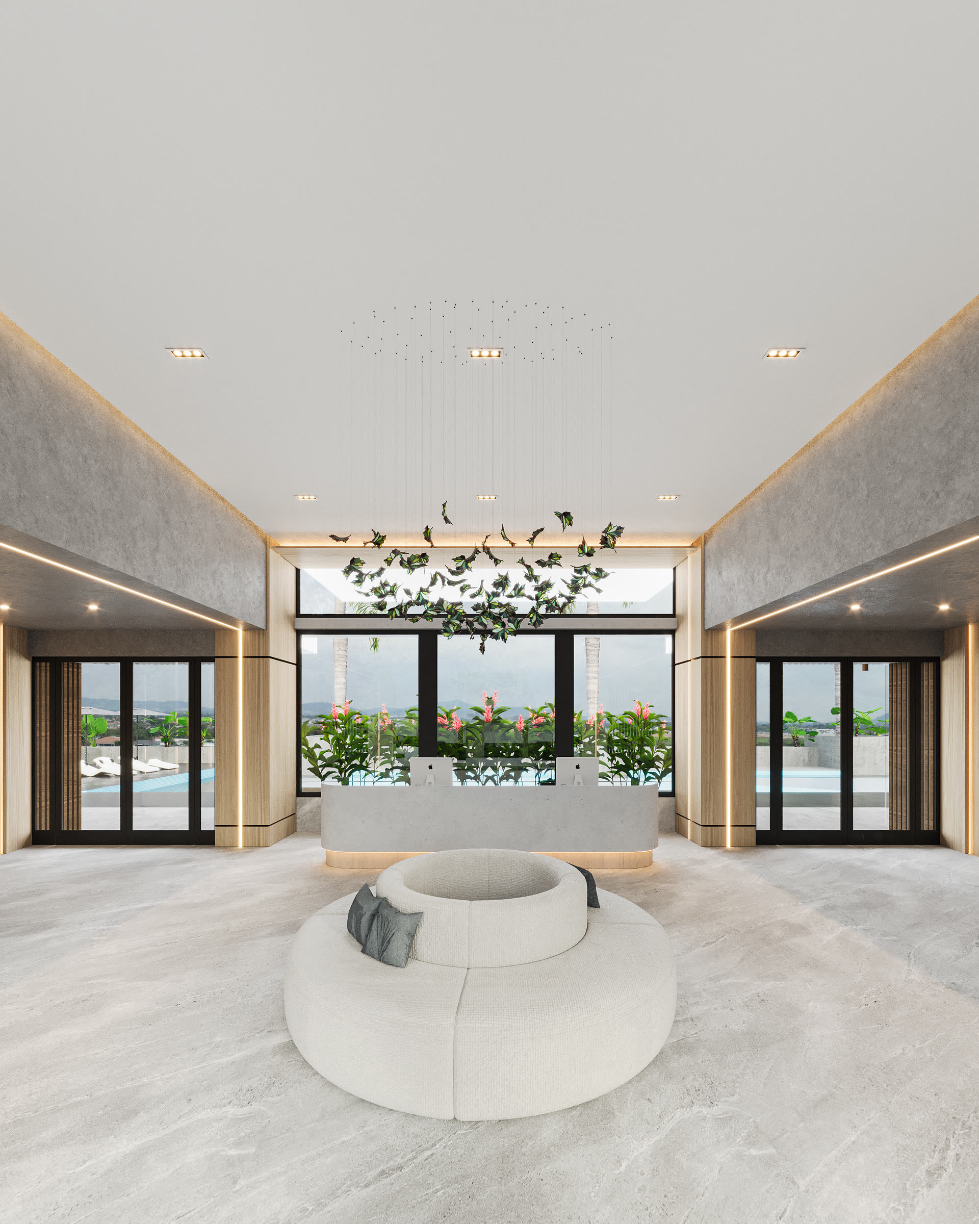 Lobby de doble altura con sofá circular y jardinera colgante